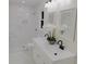 A well-lit bathroom features double sinks, white cabinetry, and a tiled shower with a showerhead at 132 Tranquil Ln, Ladson, SC 29456