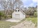 View of the detached garage with stairs to the second level and garage door at 132 Tranquil Ln, Ladson, SC 29456