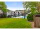 Enjoy the view of the lush green grass and community pool from the backyard of this charming condo at 1402 Camp Rd # 10C, Charleston, SC 29412