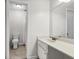 Well-lit bathroom features a vanity with a sink and a separate toilet and shower area at 1402 Camp Rd # 10C, Charleston, SC 29412