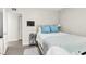 Bright bedroom featuring a bed with blue pillows and a throw blanket at 1402 Camp Rd # 10C, Charleston, SC 29412