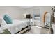 This bedroom has a bed, TV and small window letting in natural light at 1402 Camp Rd # 10C, Charleston, SC 29412