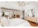 This bright bedroom shows hardwood floors, neutral tones, a work nook, and dresser at 141 Beaufain St, Charleston, SC 29401