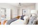 Bedroom with two twin beds, hardwood floors, overhead lighting, and closet at 141 Beaufain St, Charleston, SC 29401