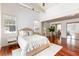 Bright bedroom features hardwood floors, neutral tones, a cozy rug, and a work nook at 141 Beaufain St, Charleston, SC 29401