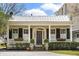 Charming home with black shutters, flower boxes, and a welcoming front porch at 141 Beaufain St, Charleston, SC 29401