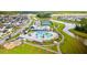 Aerial view of community pool and amenity center with a playground, walking trails and landscaping at 144 Sandy Bend Ln, Summerville, SC 29486
