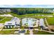 Aerial view of community pool and amenity center with a playground, walking trails, and lush landscaping at 144 Sandy Bend Ln, Summerville, SC 29486