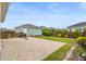 Private backyard featuring a brick paver patio, detached garage, fenced yard and well-maintained landscaping at 144 Sandy Bend Ln, Summerville, SC 29486