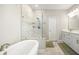 Bright bathroom features a soaking tub, glass shower and double sink vanity at 144 Sandy Bend Ln, Summerville, SC 29486