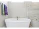 Bathroom featuring a standalone soaking tub and tiled glass-enclosed shower at 144 Sandy Bend Ln, Summerville, SC 29486
