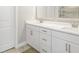 Bathroom vanity with double sinks, white cabinets, and quartz countertops at 144 Sandy Bend Ln, Summerville, SC 29486