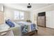Bedroom featuring a ceiling fan, natural light, hardwood floors, and ample closet space at 144 Sandy Bend Ln, Summerville, SC 29486