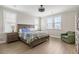 Comfortable bedroom featuring a ceiling fan, lots of natural light, and hardwood floors at 144 Sandy Bend Ln, Summerville, SC 29486