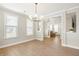 Spacious dining room with lots of natural light and hardwood floors, perfect for entertaining at 144 Sandy Bend Ln, Summerville, SC 29486
