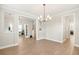Beautiful dining area with seamless transition to living spaces and modern chandelier at 144 Sandy Bend Ln, Summerville, SC 29486