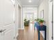 Charming entryway with console table, decor, and hardwood flooring leading into the living area at 144 Sandy Bend Ln, Summerville, SC 29486