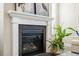 Close-up of a living room fireplace with a white mantle and black firebox at 144 Sandy Bend Ln, Summerville, SC 29486