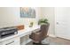 Functional home office with a built-in desk, ample lighting, and storage solutions at 144 Sandy Bend Ln, Summerville, SC 29486