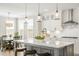 Stylish kitchen featuring a large island with seating, modern appliances, and elegant pendant lighting at 144 Sandy Bend Ln, Summerville, SC 29486
