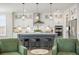 Modern kitchen featuring a large island with seating, modern appliances, and elegant pendant lighting at 144 Sandy Bend Ln, Summerville, SC 29486