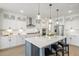Well-appointed kitchen with island, pendant lighting, stainless appliances, and white cabinets at 144 Sandy Bend Ln, Summerville, SC 29486