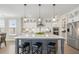 Modern kitchen features a center island, stainless steel appliances, and sleek cabinetry at 144 Sandy Bend Ln, Summerville, SC 29486