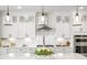 Bright kitchen boasts white cabinetry, stainless steel hood, and a center island with seating at 144 Sandy Bend Ln, Summerville, SC 29486