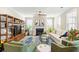 Bright living room featuring a fireplace, ceiling fan and lots of natural light at 144 Sandy Bend Ln, Summerville, SC 29486