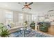 Bright living room featuring an open floor plan that leads into the kitchen at 144 Sandy Bend Ln, Summerville, SC 29486