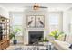 Bright living room featuring a fireplace and artwork, with lots of natural light at 144 Sandy Bend Ln, Summerville, SC 29486