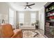 Cozy living room showcasing a white sofa, leather chair, ceiling fan and an elegant area rug at 144 Sandy Bend Ln, Summerville, SC 29486