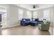 Cozy loft featuring a comfortable couch, ottoman, chair, and lots of natural light at 144 Sandy Bend Ln, Summerville, SC 29486