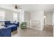 Cozy loft area with a comfortable couch and chair, plus lots of natural light at 144 Sandy Bend Ln, Summerville, SC 29486
