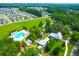 Aerial view of the community featuring a large pool, houses and green spaces at 147 Musket Loop, Summerville, SC 29483