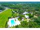 Aerial view of the community pool, manor house, and surrounding houses at 147 Musket Loop, Summerville, SC 29483