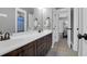 Bathroom with a double vanity, dark-wood cabinets, and neutral paint at 147 Musket Loop, Summerville, SC 29483