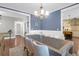 Bright dining room featuring a modern chandelier and seating for eight at 147 Musket Loop, Summerville, SC 29483