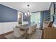 Bright dining room featuring a modern chandelier, large wood table with seating for eight, and natural light at 147 Musket Loop, Summerville, SC 29483