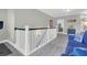 Open hallway features wainscotting detail and gray carpet at 147 Musket Loop, Summerville, SC 29483