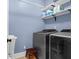 The laundry room features a sink, washer, dryer, and storage shelves at 147 Musket Loop, Summerville, SC 29483