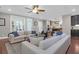 Bright living area with comfortable seating connects seamlessly to an adjacent open-concept kitchen space at 147 Musket Loop, Summerville, SC 29483