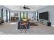 Large living room features blue walls, gray carpet and a ceiling fan at 147 Musket Loop, Summerville, SC 29483
