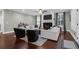 Large living room featuring lots of natural light, fireplace, hardwood floors, and modern furniture at 147 Musket Loop, Summerville, SC 29483