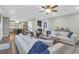 Spacious living area features an open floor plan connecting to a modern kitchen with a large island at 147 Musket Loop, Summerville, SC 29483