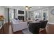 Well-lit living room featuring modern furniture, fireplace, and lots of natural light at 147 Musket Loop, Summerville, SC 29483