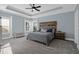 The main bedroom features a ceiling fan, a bed, and light-blue walls at 147 Musket Loop, Summerville, SC 29483