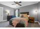 This bedroom features a bed, a ceiling fan, and light-gray walls at 147 Musket Loop, Summerville, SC 29483