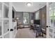 Charming home office with neutral walls, French doors, fireplace and natural light at 147 Musket Loop, Summerville, SC 29483