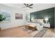 The main bedroom is bright and airy, with accent wall, ceiling fan, and plenty of natural light at 1504 Galloway Ln, Charleston, SC 29412